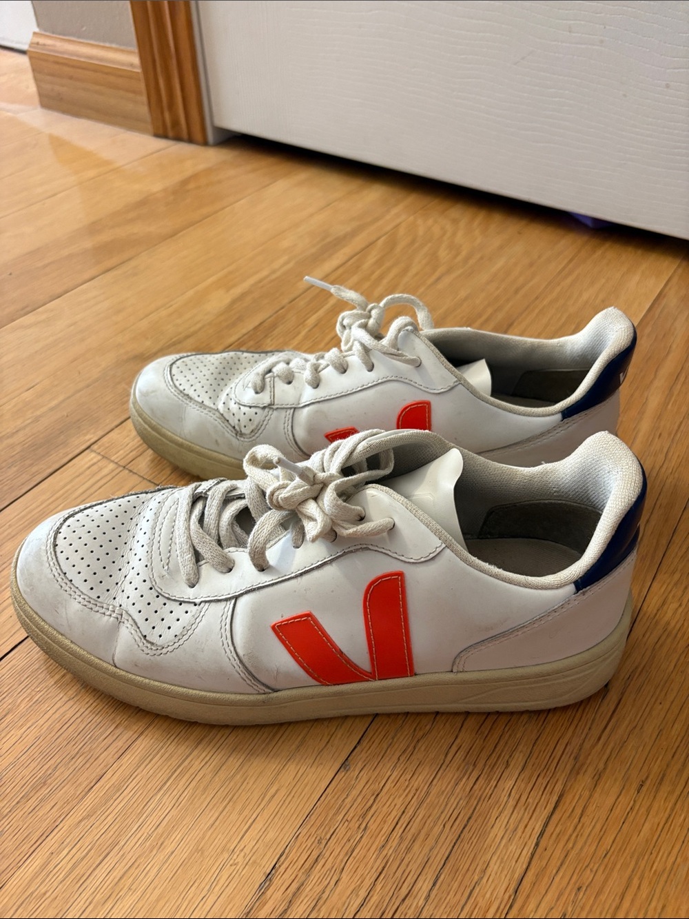 Veja womens White Leather Sneakers with Red-Orange V Accent